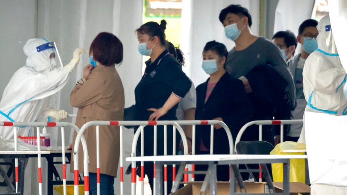 People at a Beijing coronavirus testing facility