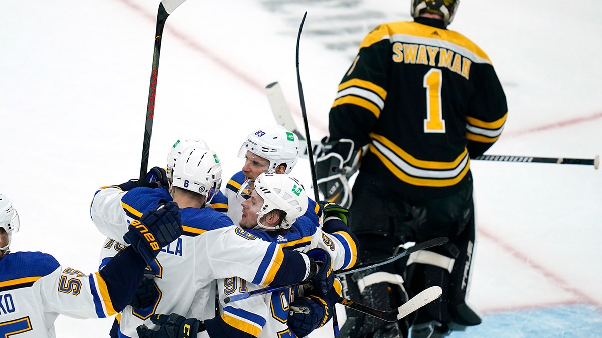 St. Louis Blues right wing Vladimir Tarasenko (91) is congratulated by teammates after his goal off Boston Bruins goaltender Jeremy Swayman (1) during the second period of an NHL hockey game, Tuesday, April 12, 2022, in Boston.