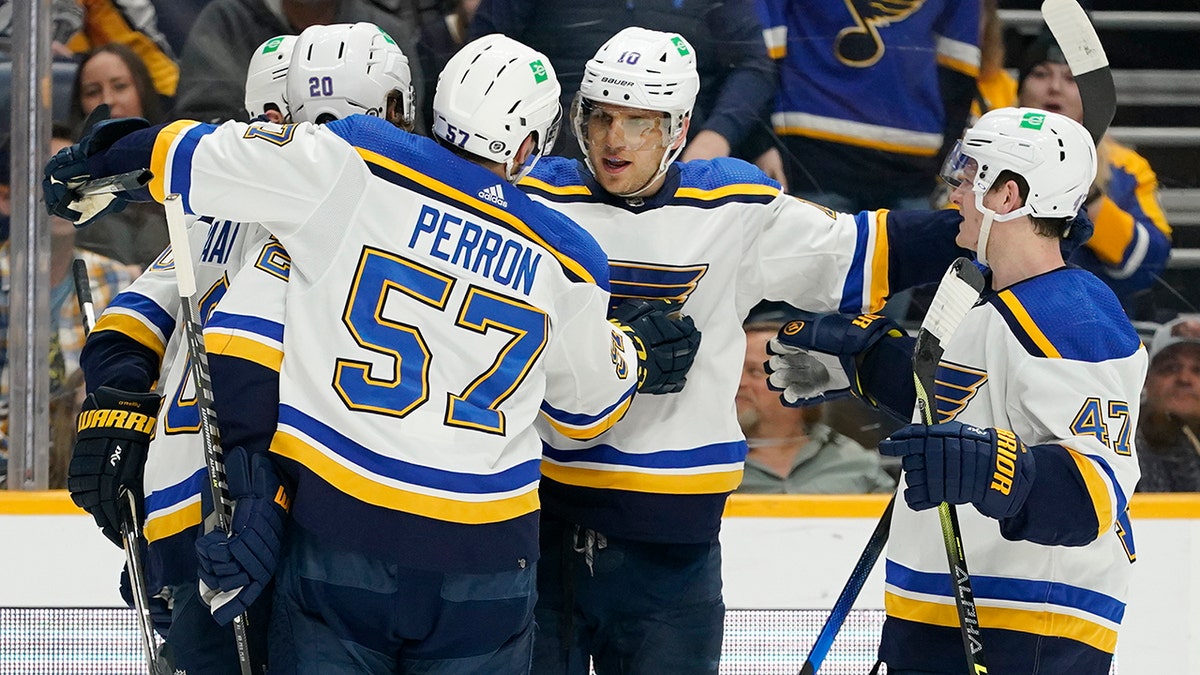 St. Louis Blues' Brayden Schenn (10) is congratulated after scoring a goal against the Nashville Predators in the first period of an NHL hockey game Sunday, April 17, 2022, in Nashville, Tenn.
