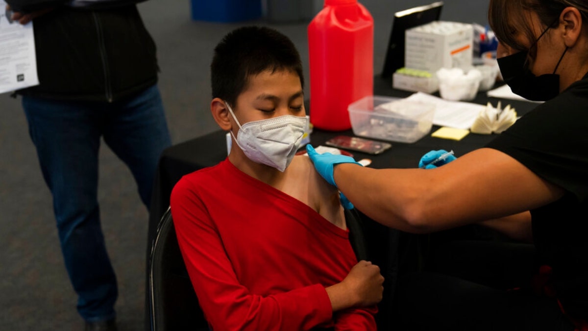 A California kid receives the Pfizer COVID-19 vaccine