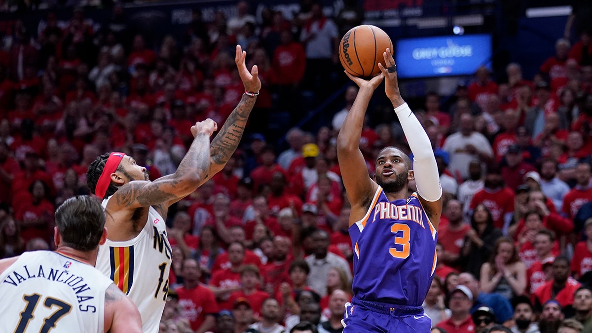 Phoenix Suns guard Chris Paul (3) shoots over New Orleans Pelicans forward Brandon Ingram in the second half of Game 6 of an NBA basketball first-round playoff series, Thursday, April 28, 2022 in New Orleans. The Suns won 115-109, to win the series 4-2 and advance to the second-round.