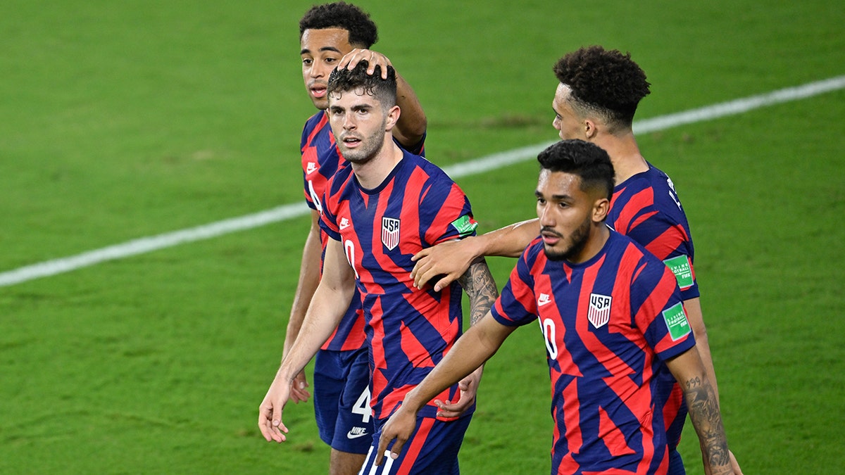 Christian Pulisic #10 of the United States celebrates scoring with teammates during a FIFA World Cup qualifier game between Panama and USMNT at Exploria Stadium on March 27, 2022 in Orlando, Florida.