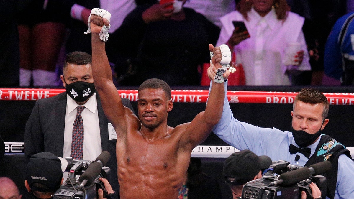 FILE - Errol Spence Jr. celebrates after defeating Danny Garcia by unanimous decision in a welterweight boxing bout in Arlington, Texas, Dec. 5, 2020.