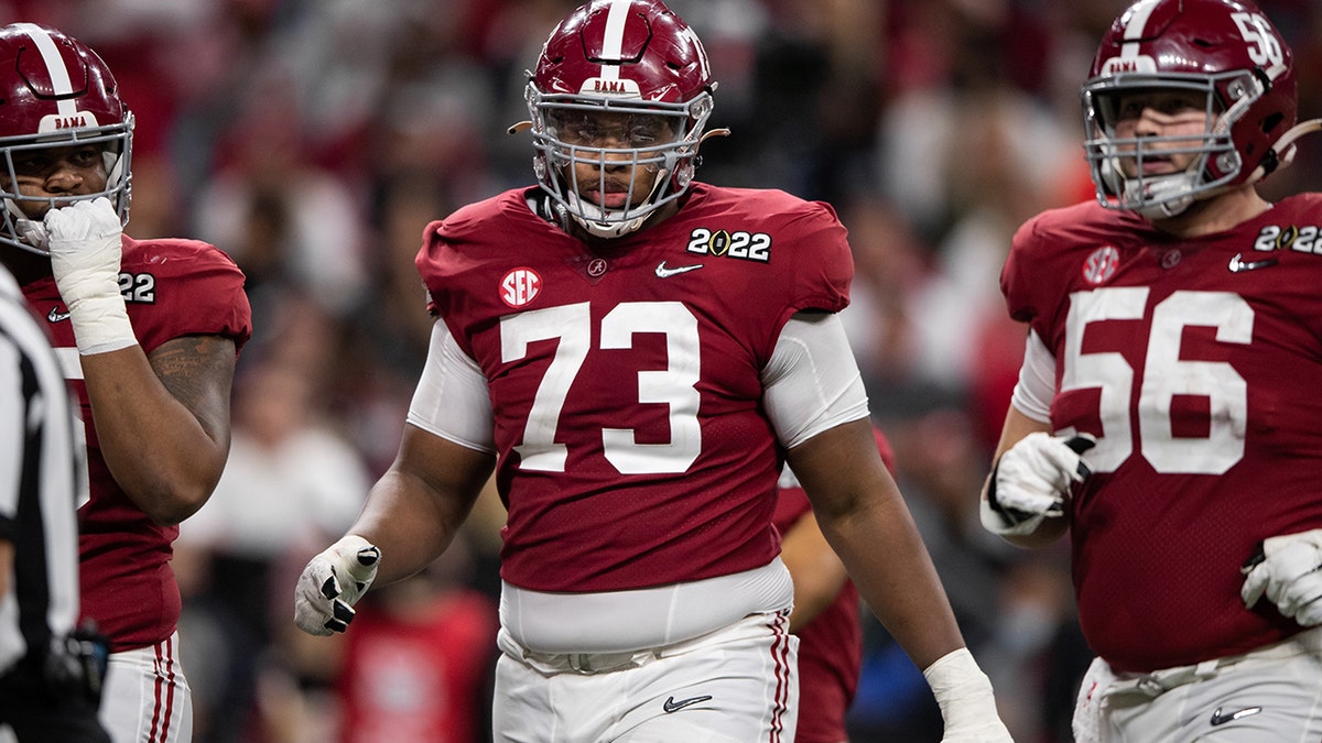 Alabama Crimson Tide OL Evan Neal (73) walks down the field during the Alabama Crimson Tide versus the Georgia Bulldogs in the College Football Playoff National Championship, on January 10, 2022, at Lucas Oil Stadium in Indianapolis, IN.