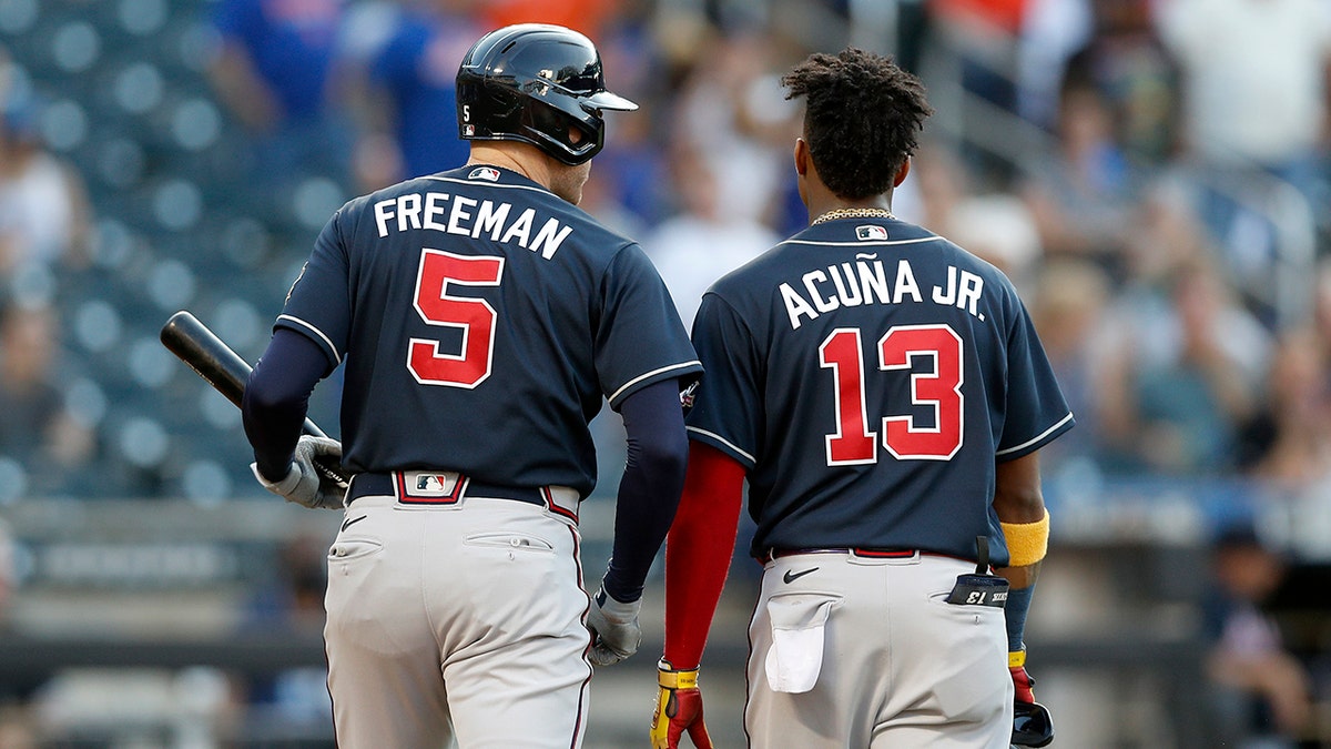 Freddie Freeman #5 and Ronald Acuna Jr. #13 of the Atlanta Braves in action against the New York Mets at Citi Field on June 21, 2021 in New York City. The Mets defeated the Braves 4-2.