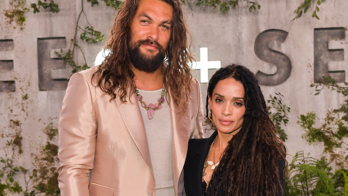 Actor Jason Momoa with Lisa Bonet at a movie premiere