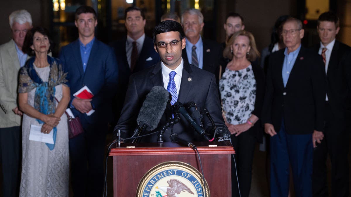 Acting US Attorney Raj Parekh (C), of the Eastern District of Virginia, speaks following the guilty pleas by Alexanda Kotey, a member of the notorious Islamic State kidnapping cell dubbed the "Beatles," to charges of conspiring to murder four American hostages, alongside the victims' families, outside the US District Court in Alexandria, Virginia, Sept. 2, 2021.?