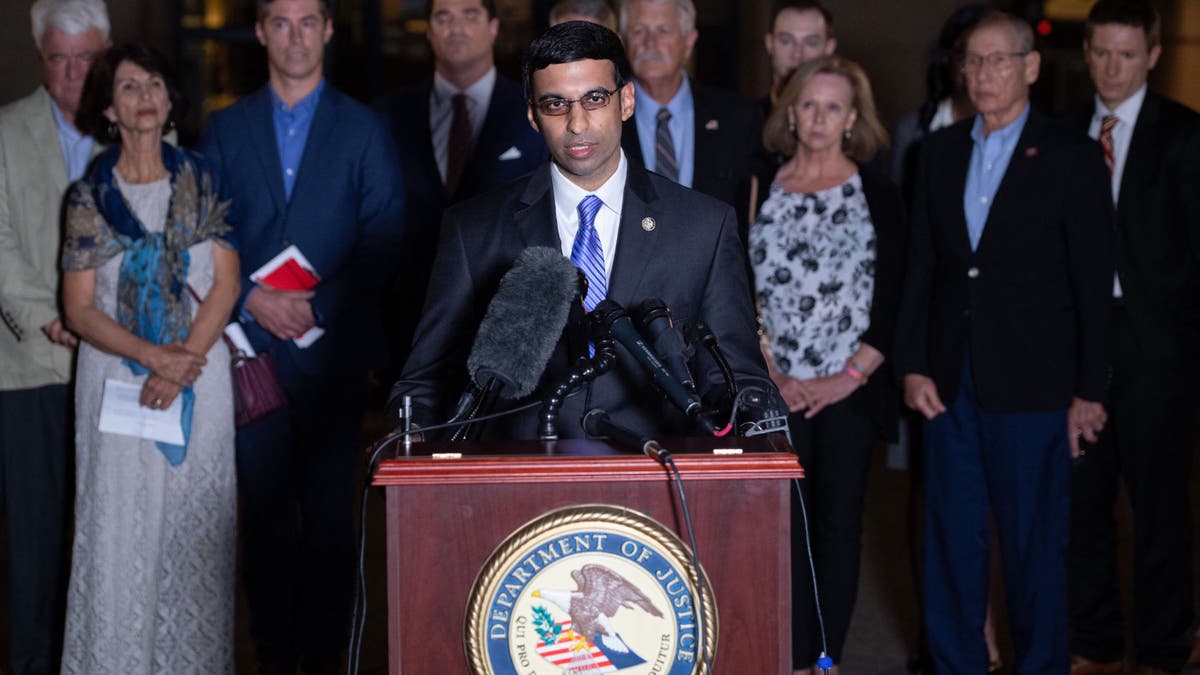 Acting US Attorney Raj Parekh (C), of the Eastern District of Virginia, speaks following the guilty pleas by Alexanda Kotey, a member of the notorious Islamic State kidnapping cell dubbed the "Beatles," to charges of conspiring to murder four American hostages, alongside the victims' families, outside the US District Court in Alexandria, Virginia, Sept. 2, 2021.