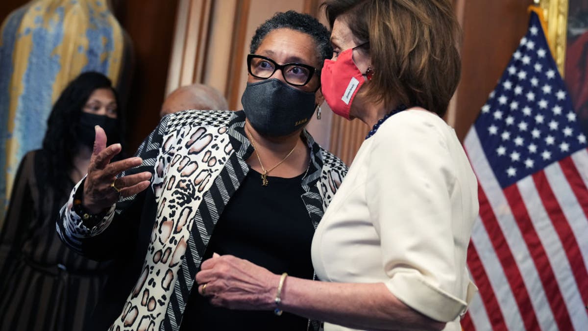 UNITED STATES - NOVEMBER 04: HUD Secretary Marcia Fudge, left, and Speaker of the House Nancy Pelosi, D-Calif., attend a swearing in ceremony for Rep. Shontel Brown, D-Ohio, in the U.S. Capitol on Thursday, November 4, 2021.