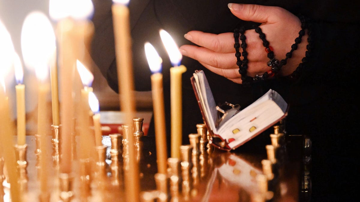 candles burn Russian Orthodox church