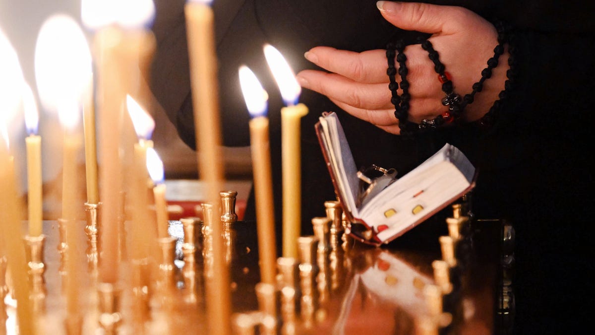 candles burn Russian Orthodox church