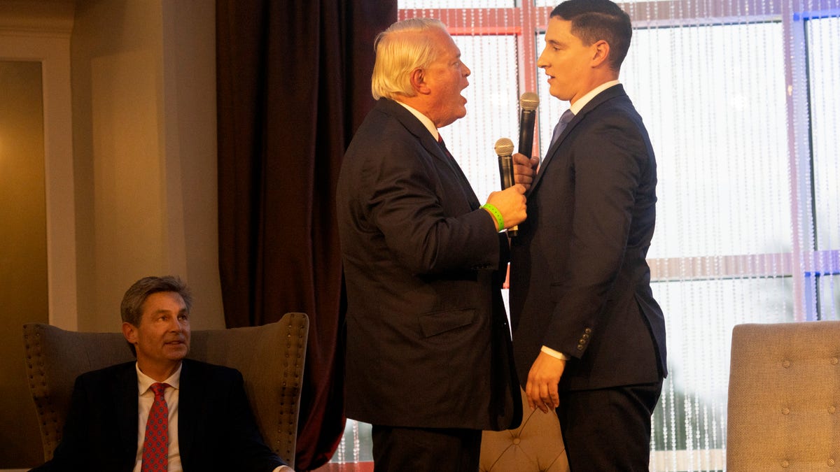 Mike Gibbons (L) and Josh Mandel exchange heated arguments at the FreedomWorks Forum for Ohio's Republican Senate Candidates on March 18, 2022, in Columbus, Ohio.