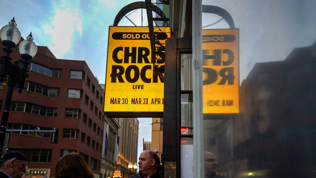 Boston, MA - March 30: Ticket holders enter the Wilbur Theater to see actor/comedian Chris Rock at the Wilbur Theater for the first of his two performances on March 30, 2022. (Photo by Barry Chin/The Boston Globe via Getty Images)