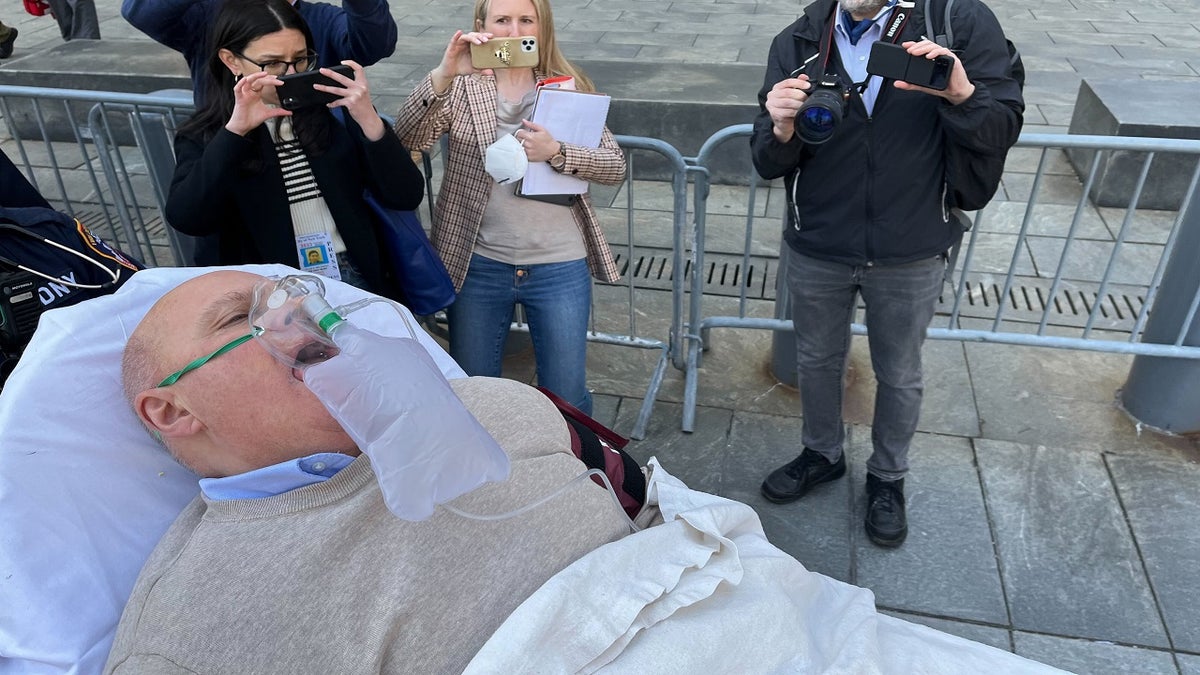 Lawrence Ray is wheeled out of court into an ambulance on Tuesday, March 22, 2022, in New York City. 