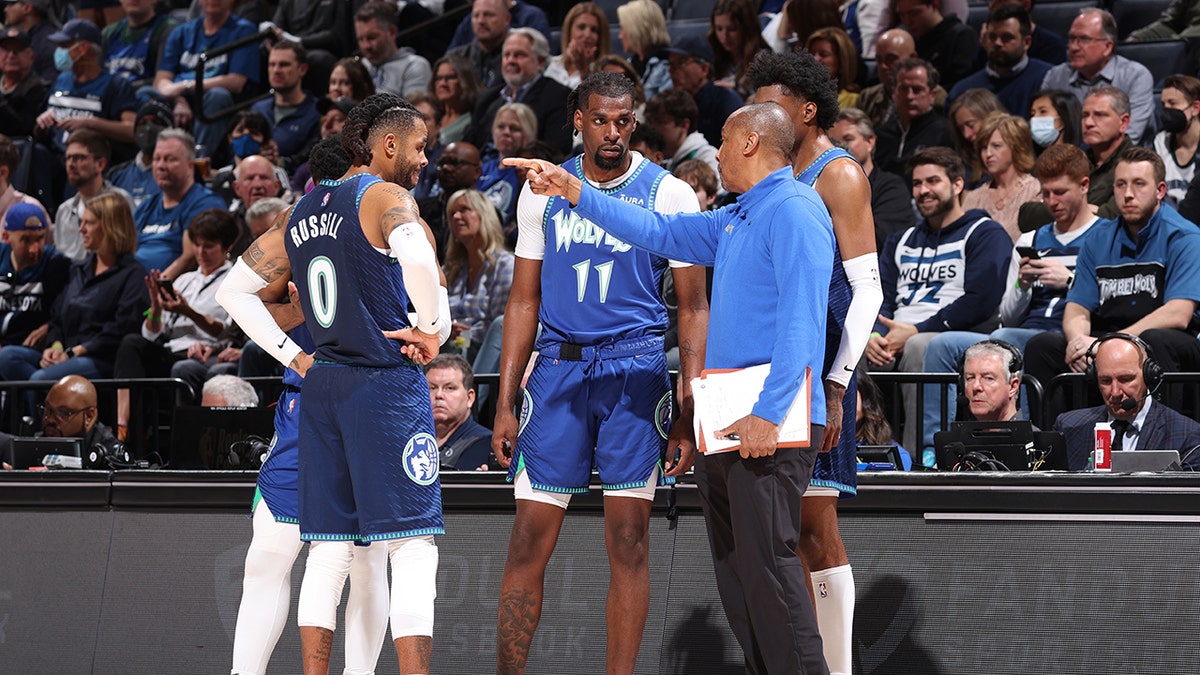 Assistant Coach, Elston Turner huddles with the D'Angelo Russell #0, Malik Beasley #5, Naz Reid #11 and Jaden McDaniels #3 of the Minnesota Timberwolves during Round 1 Game 3 of the 2022 NBA Playoffs on April 21, 2022 at Target Center in Minneapolis, Minnesota. 