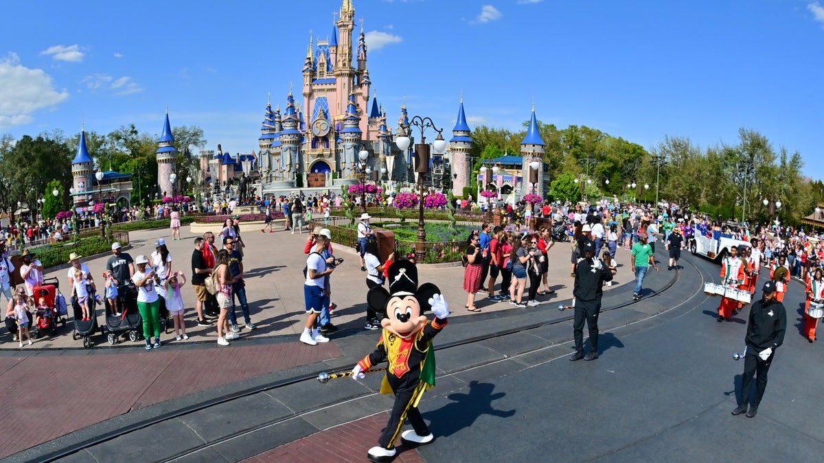 LAKE BUENA VISTA, FLORIDA - MARCH 03: Mickey Mouse waves to fans during a parade at Walt Disney World Resort on March 03, 2022 in Lake Buena Vista, Florida. (Photo by Julio Aguilar/Getty Images for Disney Dreamers Academy)