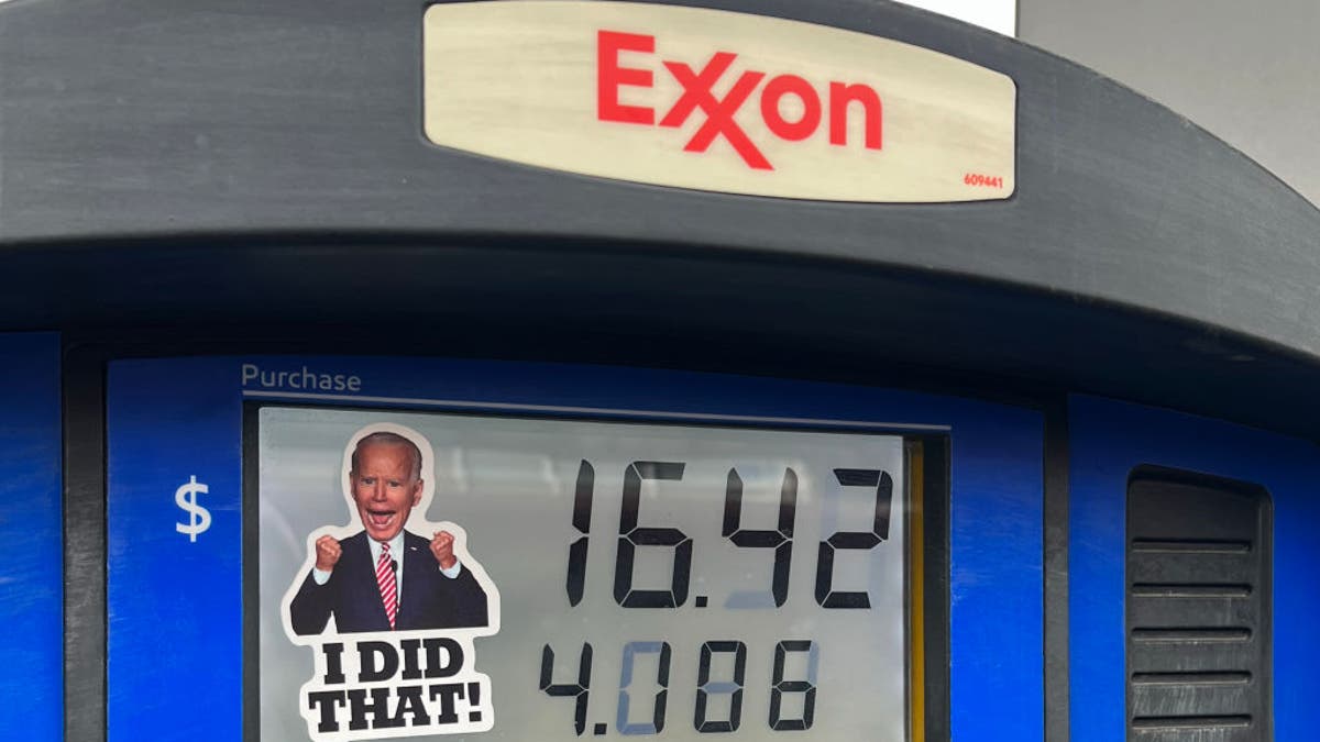 A sticker of President Joe Biden is placed on a gas pump at an Exxon Station on March 9, 2022, in Lakewood, Colorado.