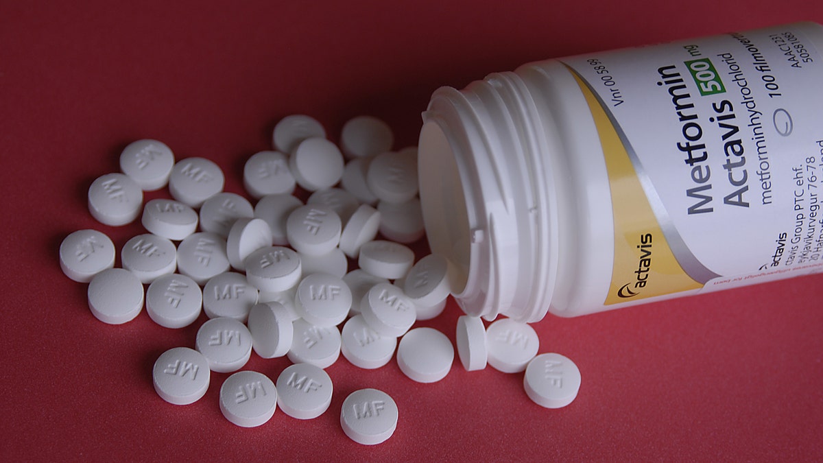 Metformin pills, diabetes medication on a table