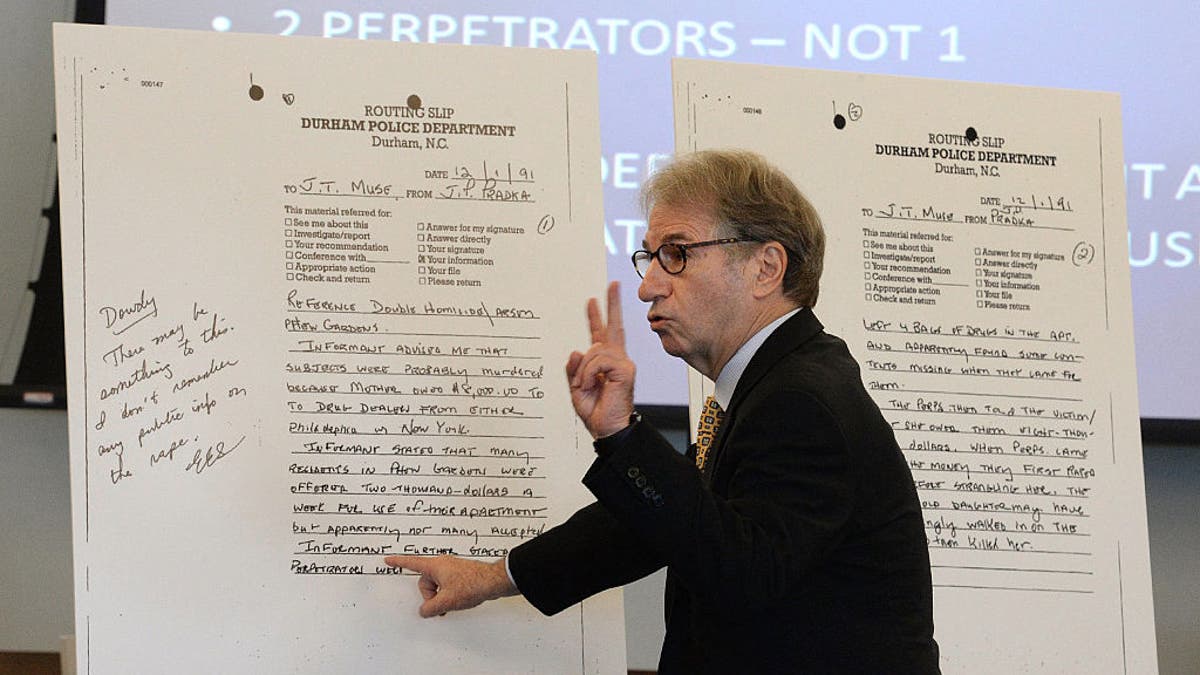 Barry Scheck, co-director of the New York-based Innocence Project, goes over copies of police notes during a hearing for relief in the Darryl Anthony Howard murder case at the Durham County Judicial Center in Durham, North Carolina, on Wednesday, Aug. 31, 2016.