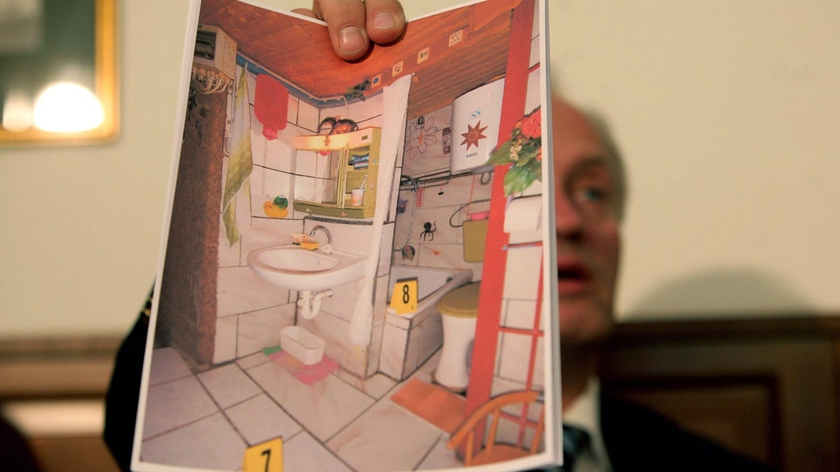 Colonel Franz Polzer, chief investigator of the district of Lower Austria shows a detail picture of the cellar appartement, where a father imprisoned his daughter for 24 years and had seven children with her, during a press conference on April 28, 2008 in Amstetten, Austria. According to police Josef F. kept his daughter Elizabeth, now 42, imprisoned in his basement and sexually abused her. Three of the children, now aged 5, 18 and 19, had never seen the light of day until the eldest was recently taken to hospital because of a severe illness. 