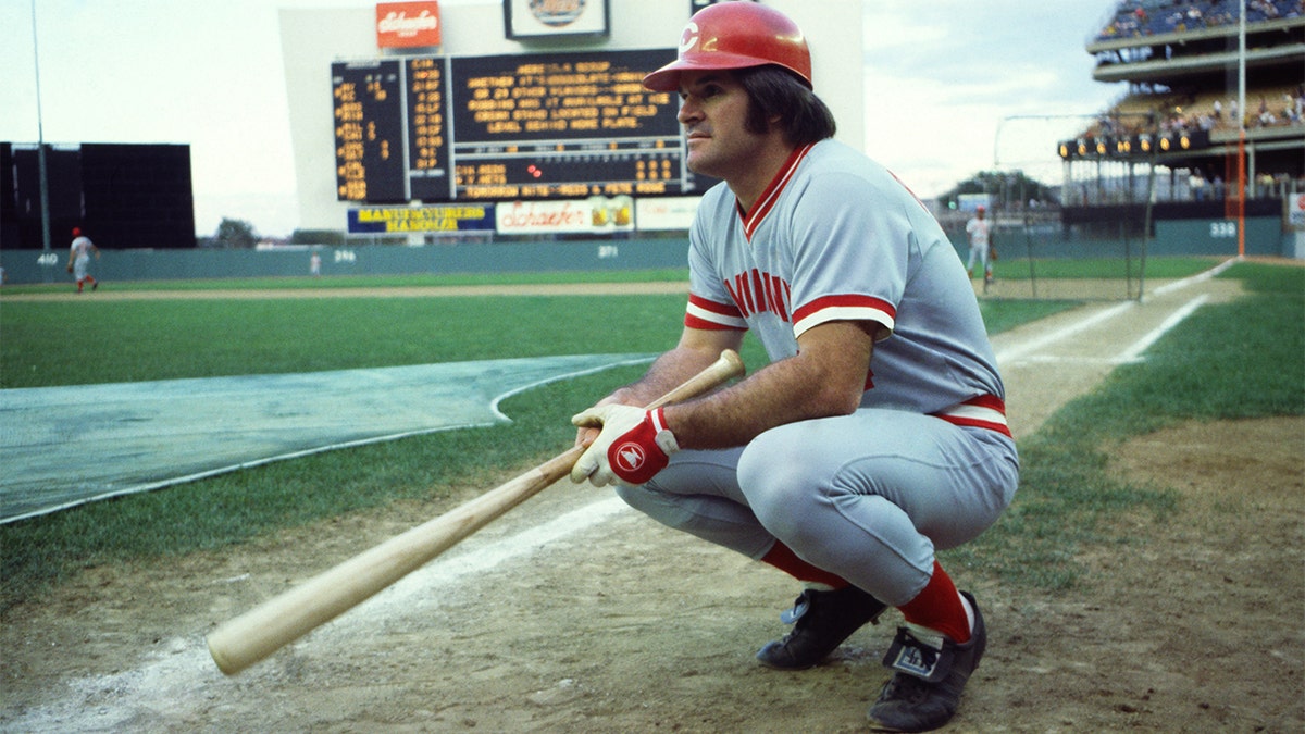 American baseball player Pete Rose, of the Cincinatti Reds, crouches on the field before a game at Shea Stadium in Flushing Meadows-Corona Park, Queens, New York, New York, July 24, 1978. The game, against the New York Mets, resulted in Rose increasing his hitting streak to 37 consecutive games (the streak eventually lasted 44 games).