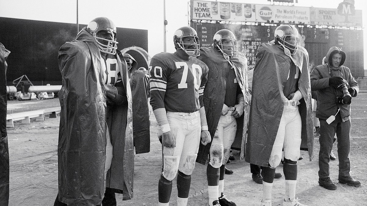 Football: Minnesota Vikings "Purple People Eaters" (L-R) Alan Page (88), Jim Marshall (70), Gary Larsen (77) and Carl Eller (81) on the sidelines during game vs Chicago Bears. Bloomington, MN 12/5/1970 