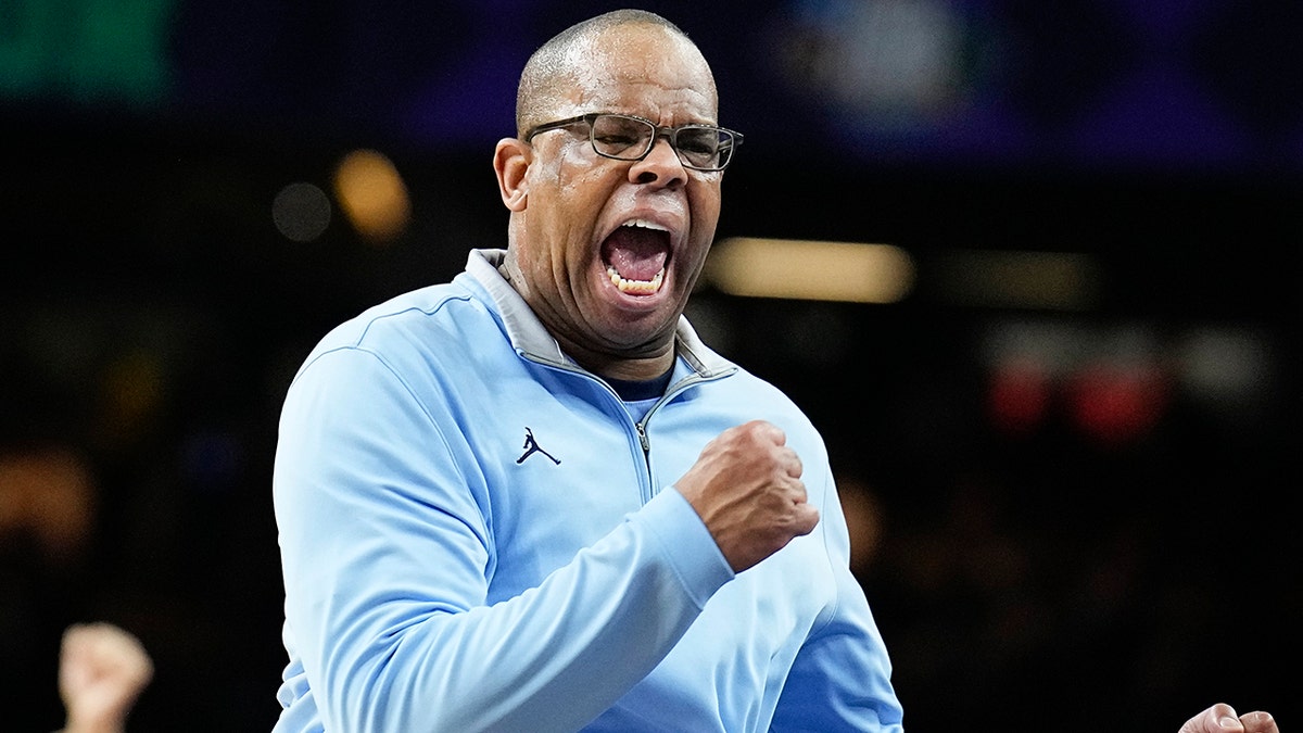 North Carolina head coach Hubert Davis reacts to a play during the first half of a college basketball game against Duke in the semifinal round of the Men's Final Four NCAA tournament, Saturday, April 2, 2022, in New Orleans.