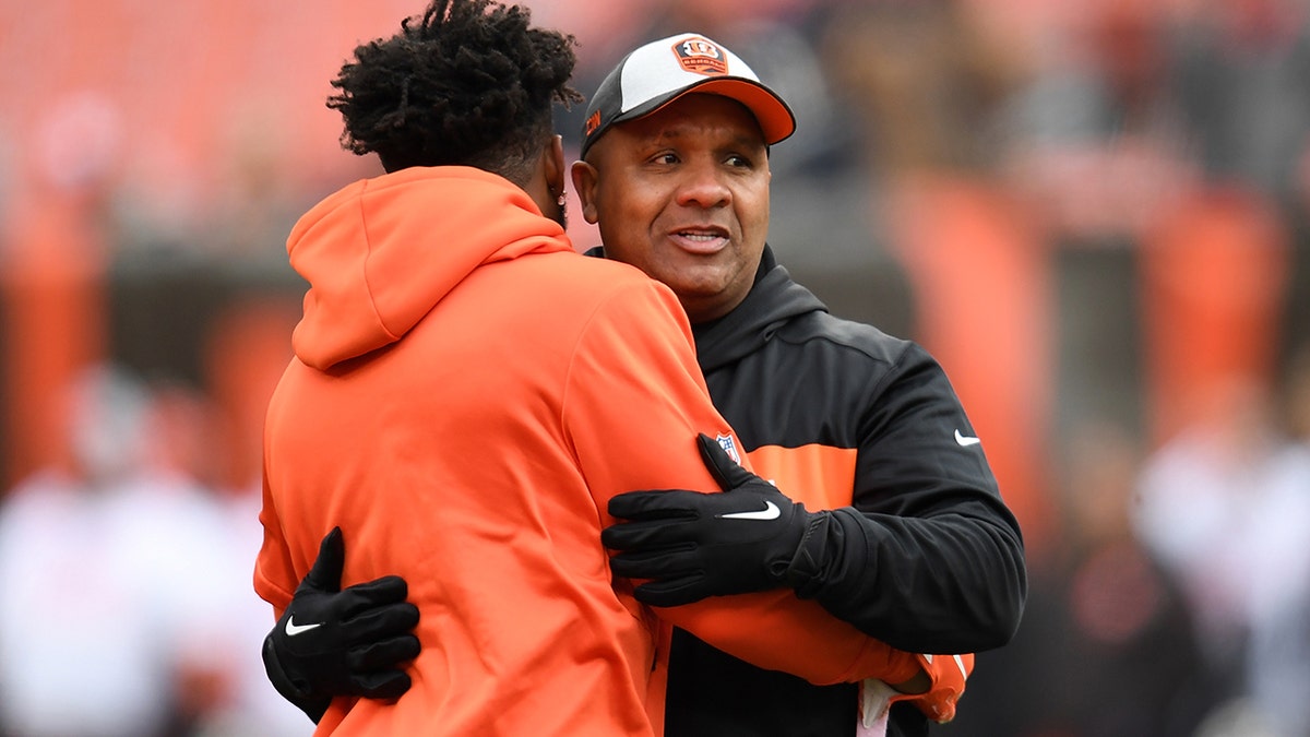 Special assistant to the head coach Hue Jackson of the Cincinnati Bengals talks with Jarvis Landry of the Cleveland Browns prior to the game at FirstEnergy Stadium on Dec. 23, 2018 in Cleveland, Ohio.