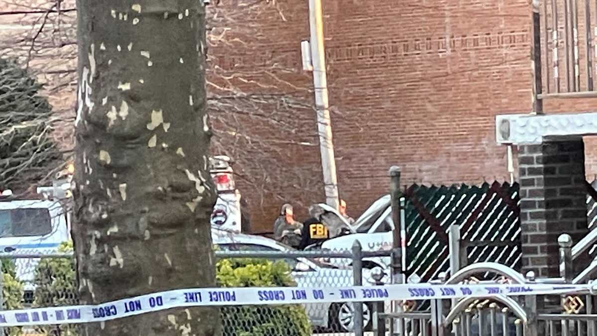 Police and federal investigators examine a U-Haul van found parked on Kings Highway in Brooklyn Tuesday, linked to person of interest Frank James.