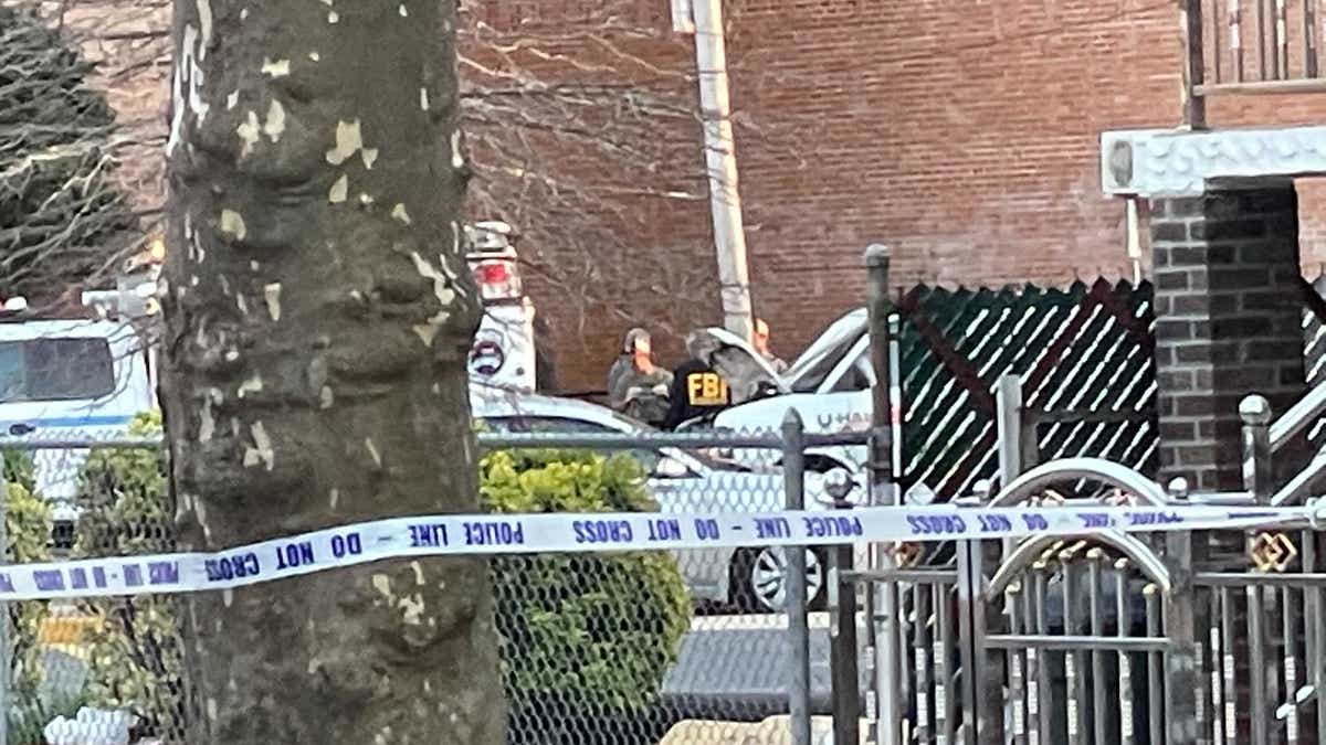 Police and federal investigators examine a U-Haul van found parked on Kings Highway in Brooklyn Tuesday, linked to person of interest Frank James.