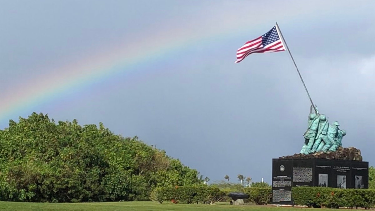 Marine Corps Air Station Kaneohe Bay entrance, Pacific WWII War Memorial underneath a rainbow, in Oahu, Hawaii, Feb. 2019. (iStock)