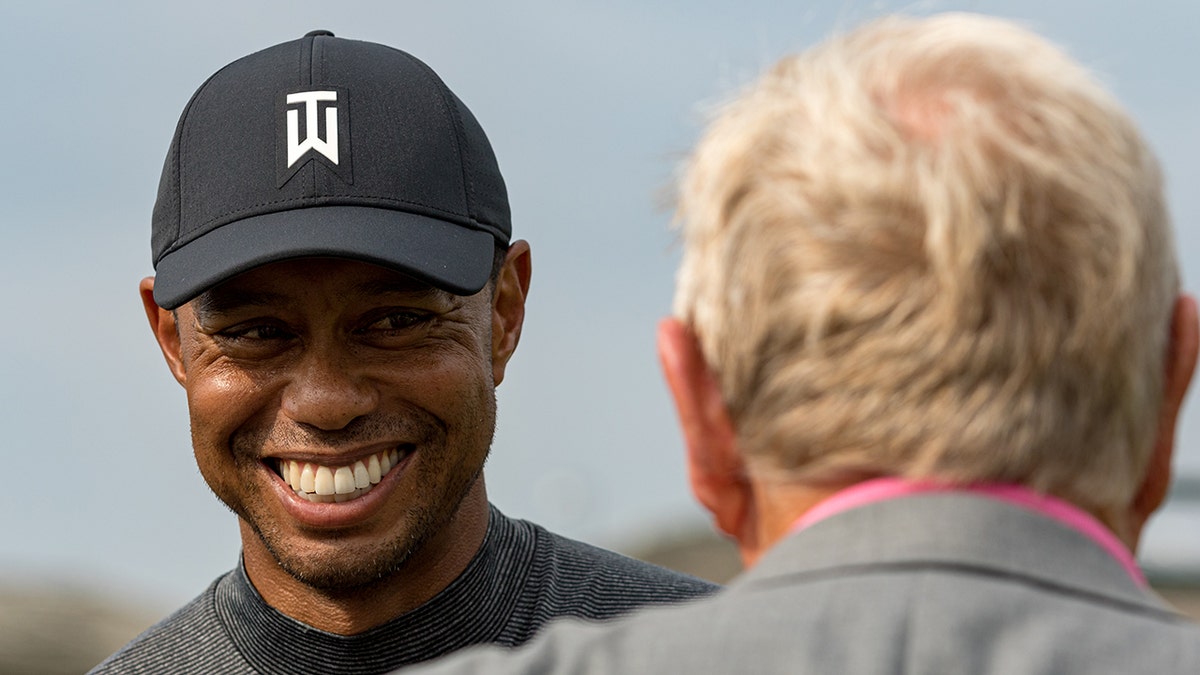 Tiger Woods shares a moment with Jack Nicklaus