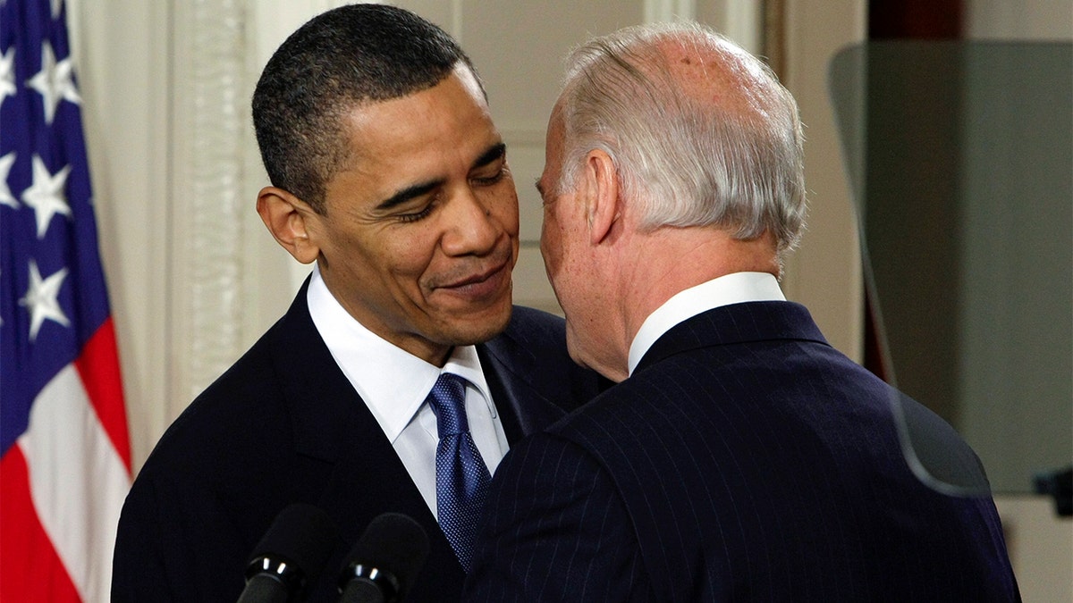 FILE - Vice President Joe Biden whispers "This is a big f------ deal," to President Barack Obama after introducing Obama during the health care bill ceremony in the East Room of the White House in Washington, March 23, 2010. (AP Photo/J. Scott Applewhite, File)