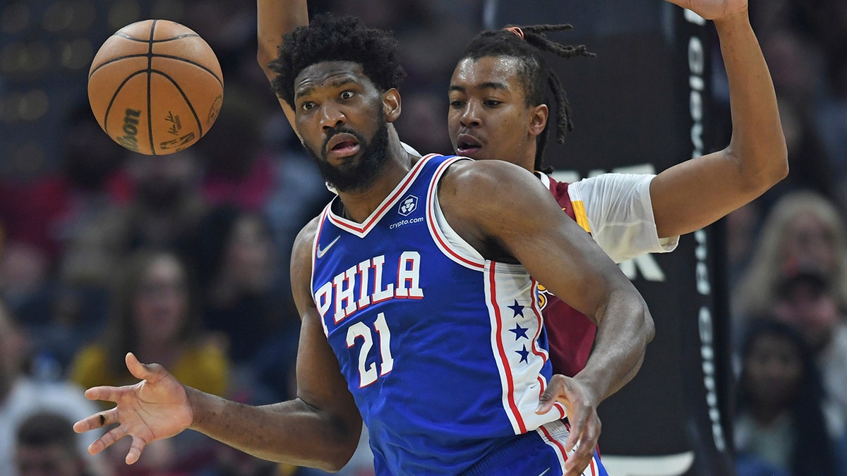 Philadelphia 76ers center Joel Embiid (21) reacts after turning the ball over in the first half of an NBA basketball game against the Cleveland Cavaliers, Sunday, April 3, 2022, in Cleveland.