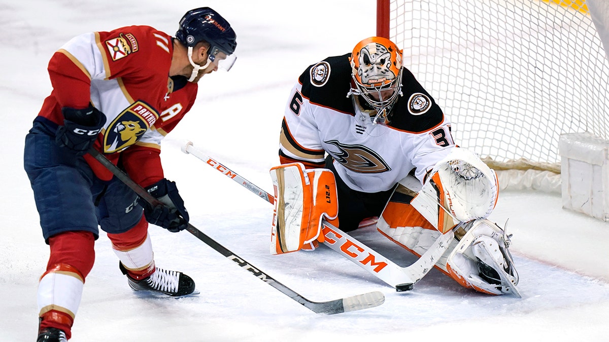 Florida Panthers left wing Jonathan Huberdeau (11) sets up a shot to score a goal against Anaheim Ducks goaltender John Gibson during overtime in an NHL hockey game, Tuesday, April 12, 2022, in Sunrise, Fla. The Panthers won 3-2.