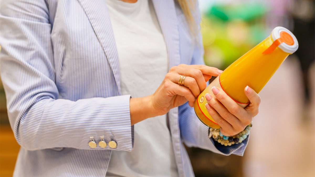 woman holding juice