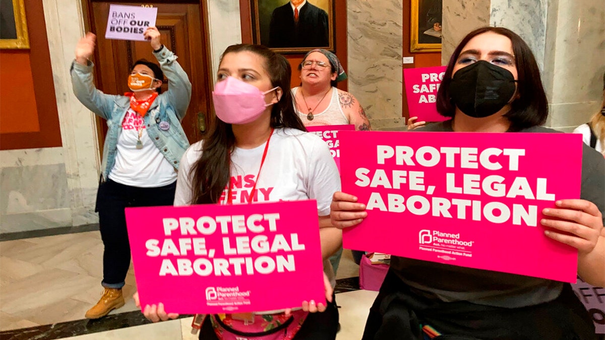 Abortion-rights supporters chant their objections at the Kentucky Capitol on Wednesday, April 13, 2022, in Frankfort, Ky., as Kentucky lawmakers debate overriding the governor's veto of an abortion measure. 