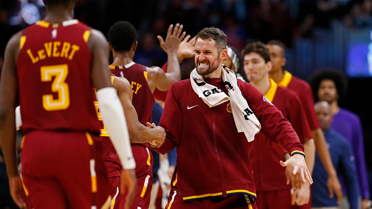 Kevin Love of the Cleveland Cavaliers hi-fives teammates during the game against the LA Clippers 