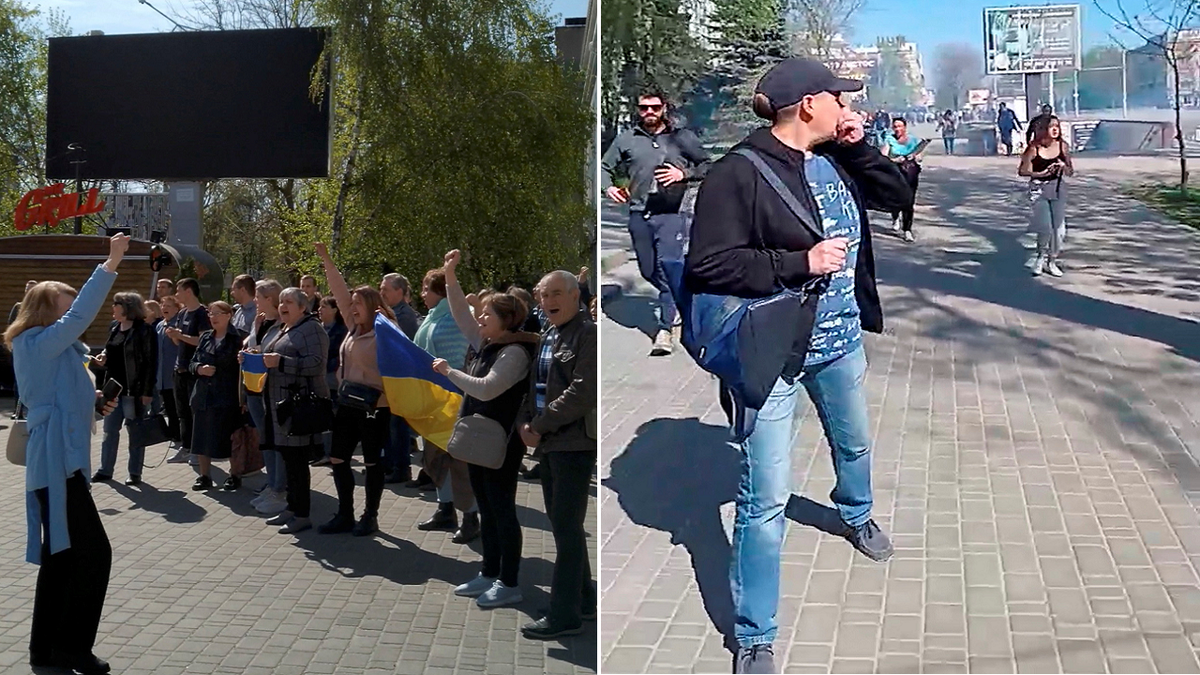 People are seen fleeing from the rally in Kherson on Wednesday, April 27.