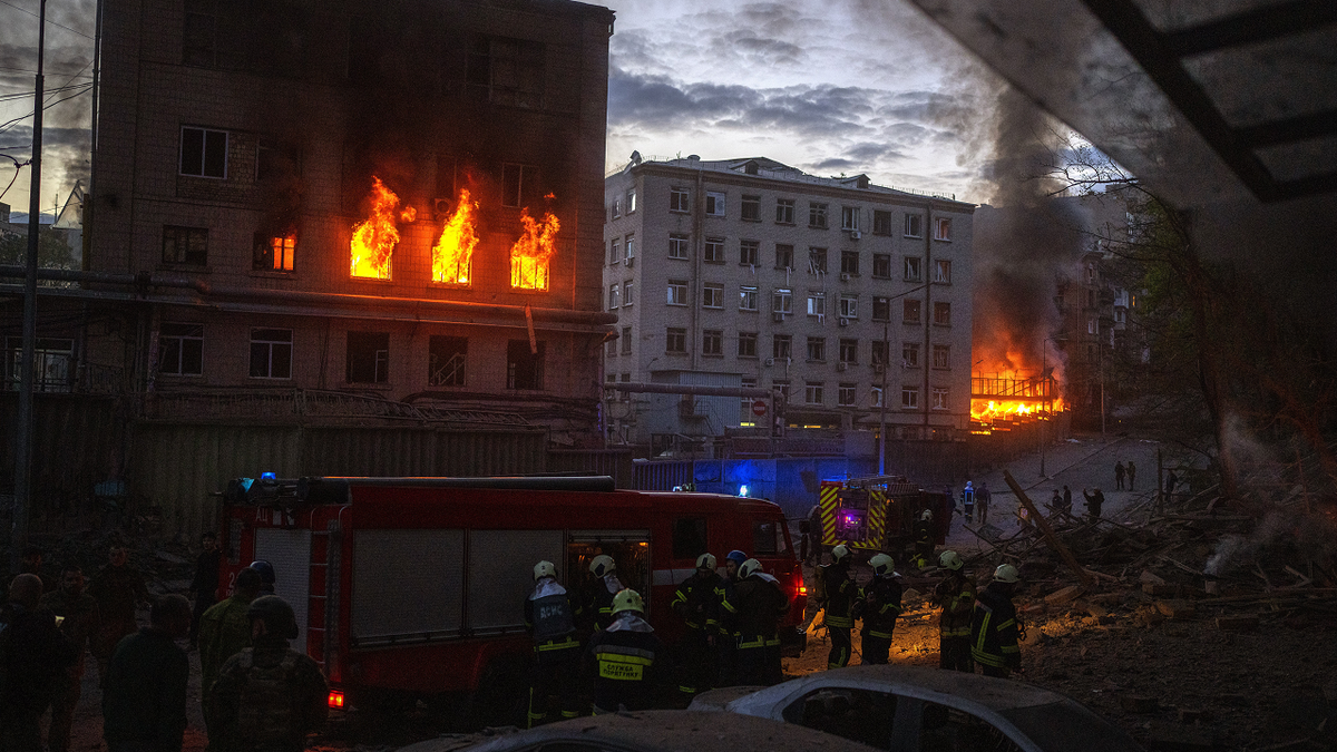 First responders work at the site where fires were triggered by an explosion in Kyiv, Ukraine, on Thursday, April 28.