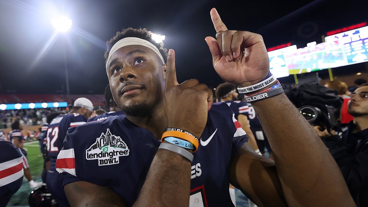 Malik Willis #7 of the Liberty Flames reacts during the LendingTree Bowl at Hancock Whitney Stadium on December 18, 2021 in Mobile, Alabama.
