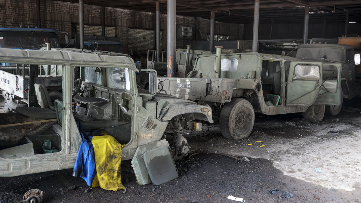 Damaged Ukrainian army military vehicles with a Ukrainian national flag are seen at the partly destroyed Illich Iron & Steel Works Metallurgical Plant, in an area controlled by Russian-backed separatist forces in Mariupol, Ukraine, on Monday.