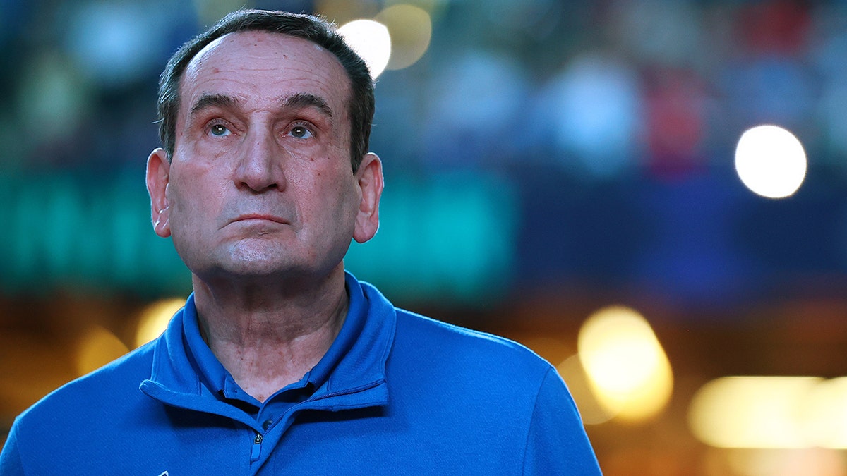 Head coach Mike Krzyzewski of the Duke Blue Devils looks to the crowd before taking on the North Carolina Tar Heels in the semifinal game of the 2022 NCAA Men's Basketball Tournament Final Four at Caesars Superdome on April 02, 2022 in New Orleans, Louisiana.