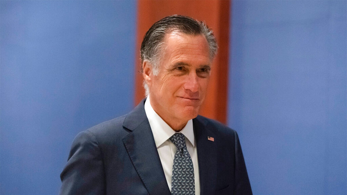 FILE - Sen. Mitt Romney, R-Utah, arrives to watch a speech by Ukrainian President Volodymyr Zelenskyy live-streamed into the U.S. Capitol, in Washington, March 16, 2022.