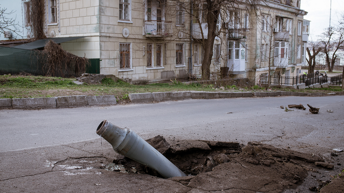 A fallen rocket that was fired from Kherson but got intercepted by Ukrainian forces remains unexploded in the street in Mykolaiv, Ukraine on April 4.