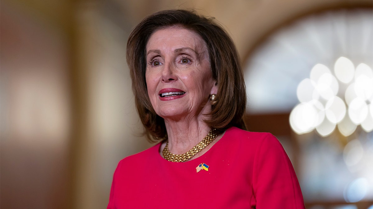 Speaker of the House Nancy Pelosi, D-Calif., stands as she welcomes Prime Minister Lee Hsien Loong of Singapore for talks at the Capitol in Washington, Wednesday, March 30, 2022. (AP Photo/J. Scott Applewhite)