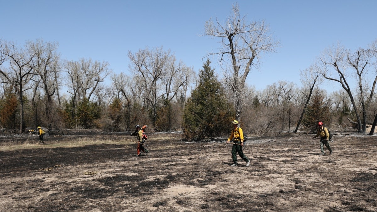 Firefighters work on Nebraska's Road 702 Fire