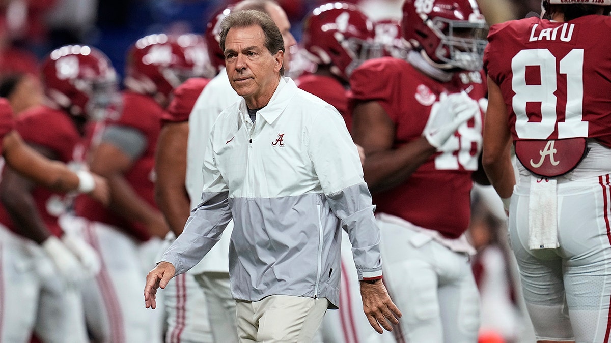 Nick Saban watches his players