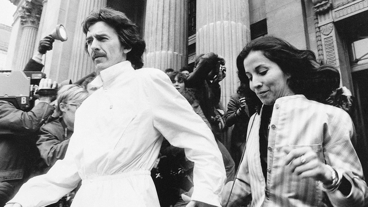 Former Beatle George Harrison and his wife Olivia leave the Marylebone Register office in London after attending the wedding of former Beatle drummer Ringo Starr April 27, 1981.