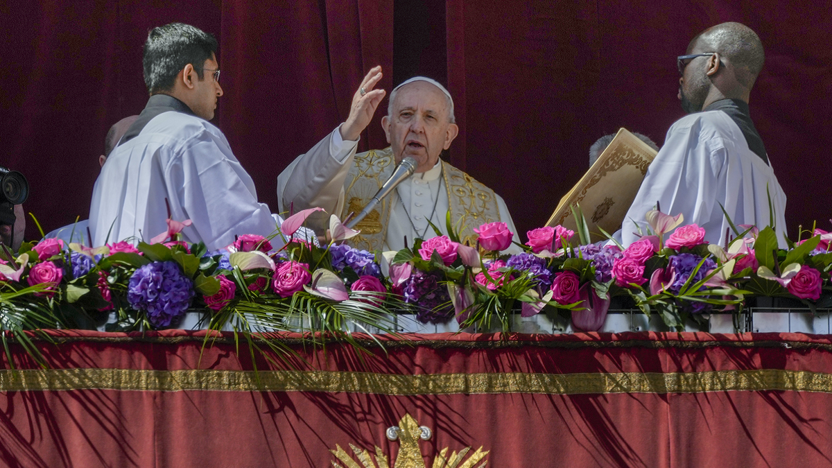 Pope Francis delivers the traditional 'Urbi et Orbi' (To the city and to the world) blessing at the end of the Catholic Easter Sunday mass he led in St. Peter's Square at the Vatican on Sunday.